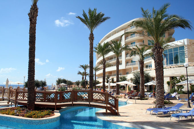 Pool area and Sunset tower at Golden Sands Resort and Spa